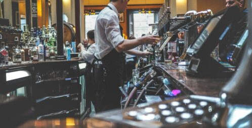 busy bartenders behind bar