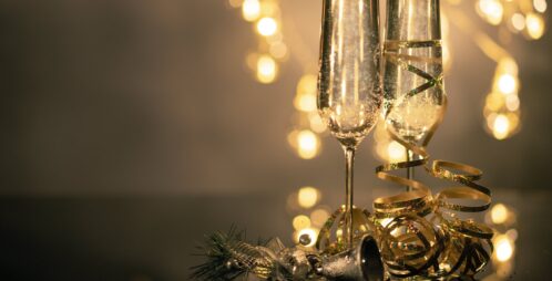 holiday champaign flutes and gold ribbon