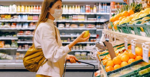 woman shops for lemons
