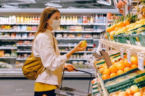 woman shops for lemons