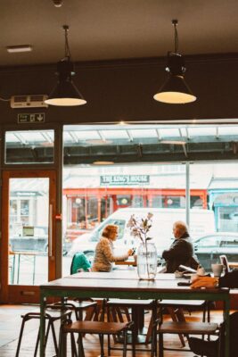 two women dine at windowside cafe