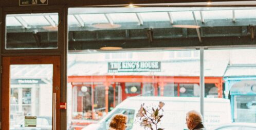 two women dine at windowside cafe