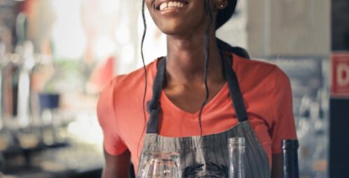 smiling waitress in apron