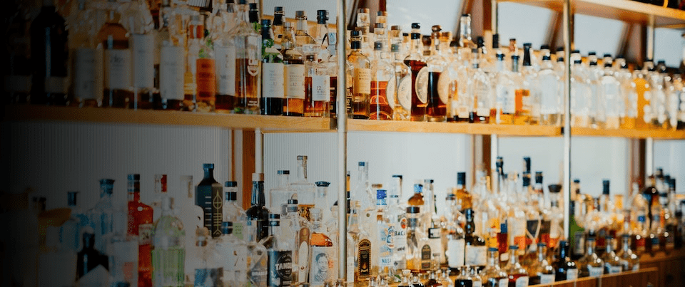 shelves stocked with liquor bottles