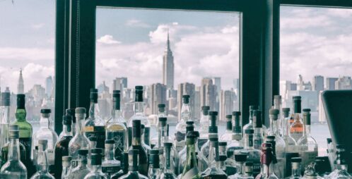 liquor bottles with city skyline
