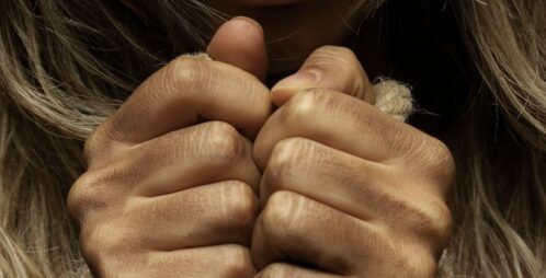 women with hands tied